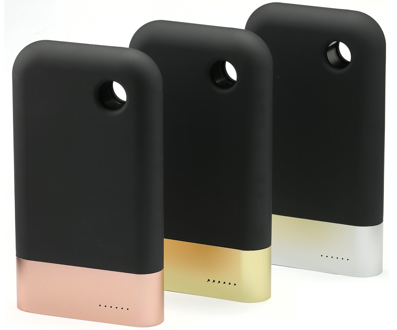 Three standing large black power banks with metal bands silver, gold and copper colour