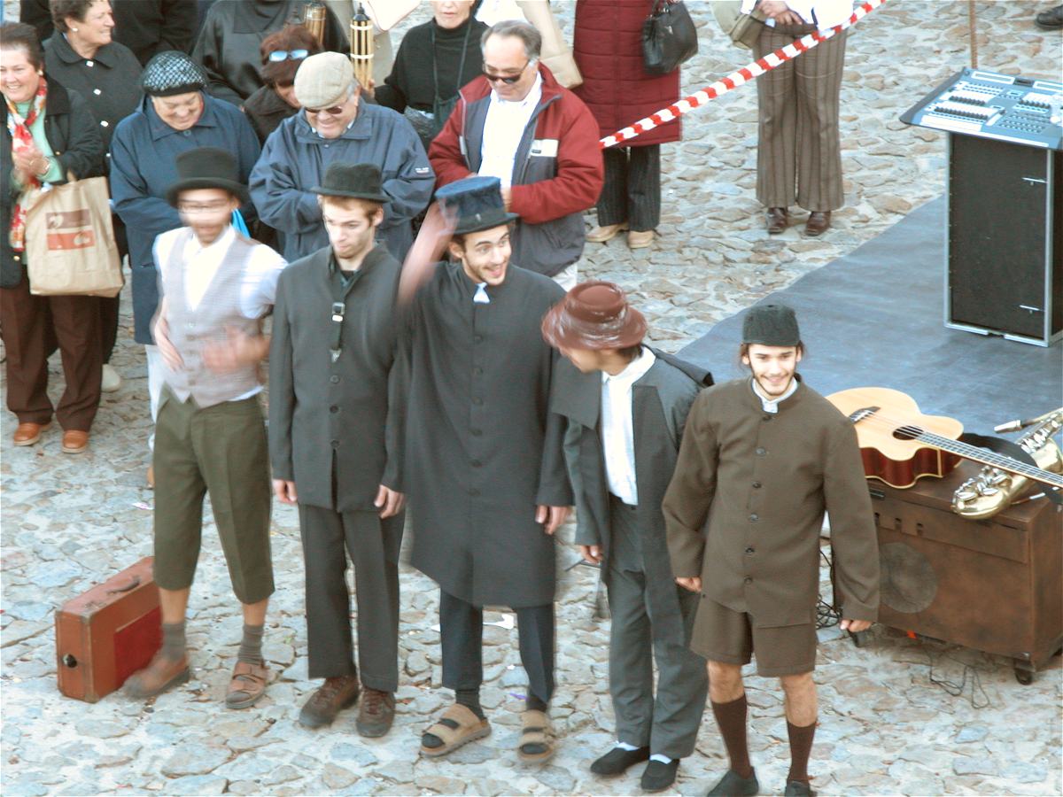 Juggling street entertainers amongst a crowd at Marvao Chestnut Festival in Portugal